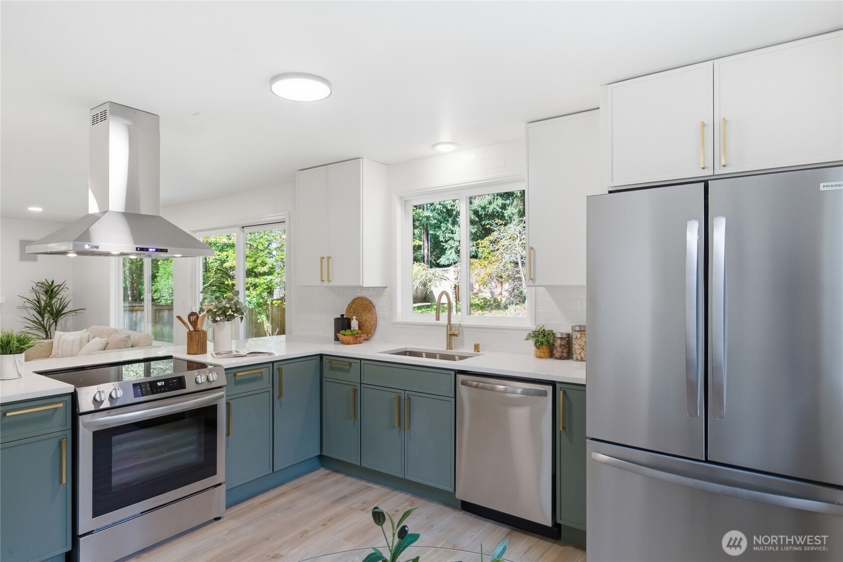 19419 133rd Avenue Southeast Renton, WA 98058 - Photo 14 of 40 a kitchen with stainless steel appliances a sink stove and refrigerator
