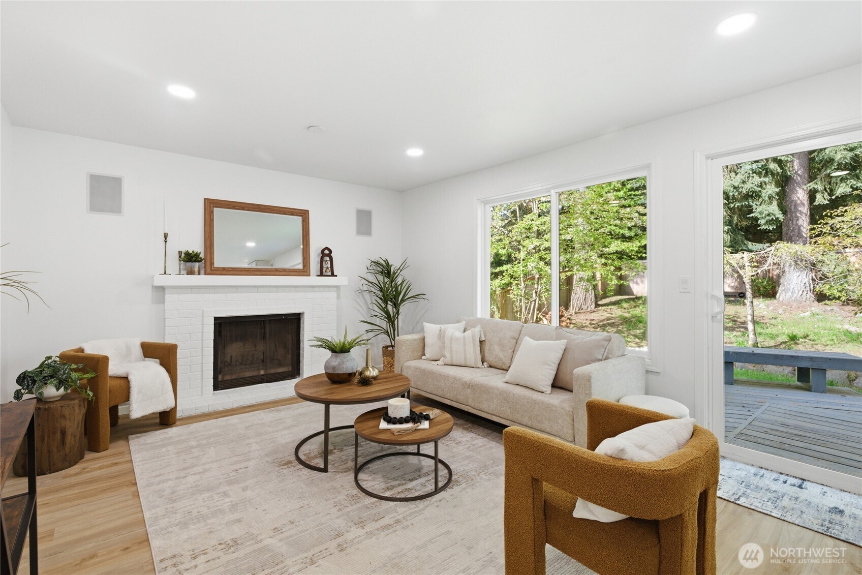 19419 133rd Avenue Southeast Renton, WA 98058 - Photo 17 of 40 a living room with furniture a fireplace and a large window