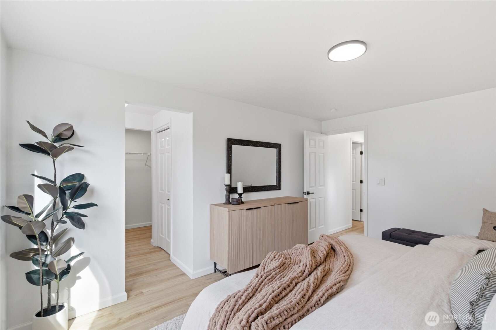 19419 133rd Avenue Southeast Renton, WA 98058 - Photo 29 of 40 a bedroom with a bed and a wooden floor