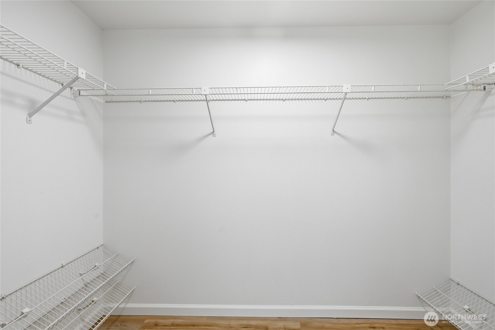 19419 133rd Avenue Southeast Renton, WA 98058 - Photo 32 of 40 a view of a room with racks on the wall