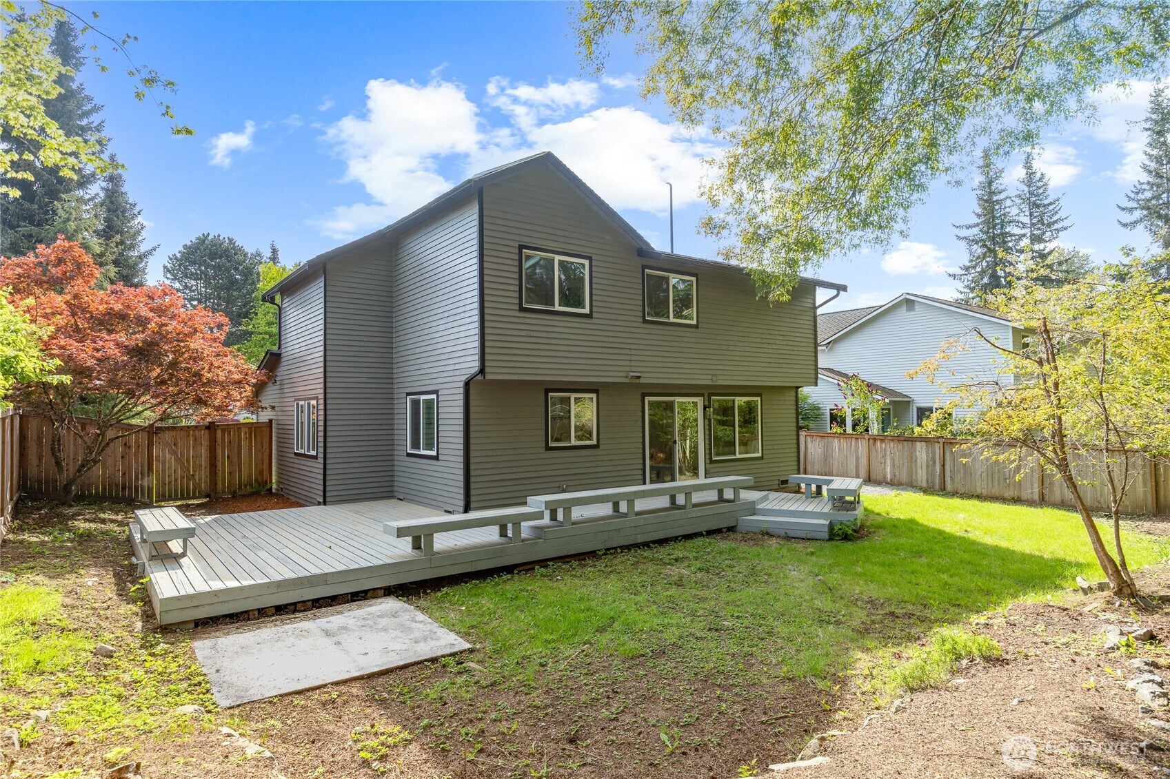 19419 133rd Avenue Southeast Renton, WA 98058 - Photo 36 of 40 a backyard of a house with table and chairs