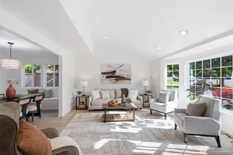 a living room with furniture and a table