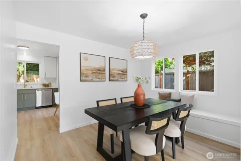 a view of a dining room with furniture window and outside view