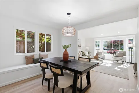 a kitchen with stainless steel appliances granite countertop a window and a refrigerator