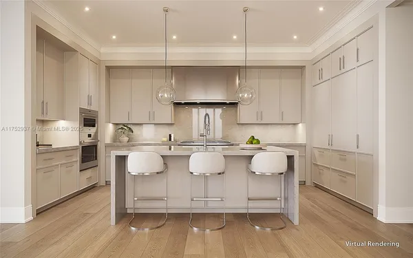 a kitchen with kitchen island white cabinets and refrigerator