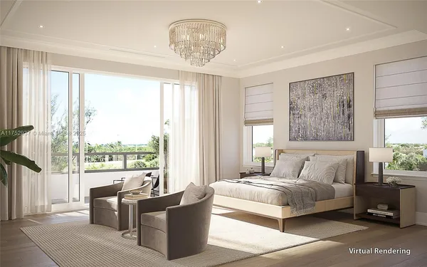 a bedroom with a large bed and a chandelier
