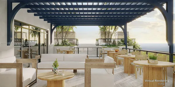 a living room with couches and a table with garden view