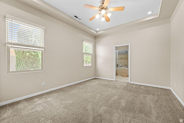2226 East 140 South St. George, UT 84790 - Photo 14 of 20 Spacious room featuring tray ceilings, recessed lighting, and a ceiling fan with light fixture