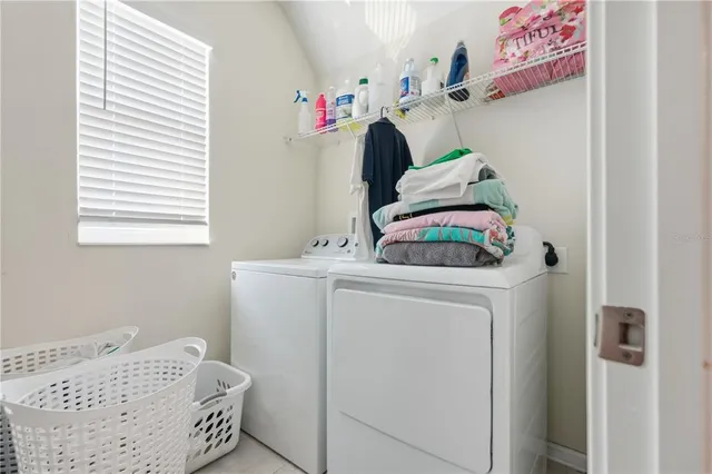 a utility room with dryer and washer