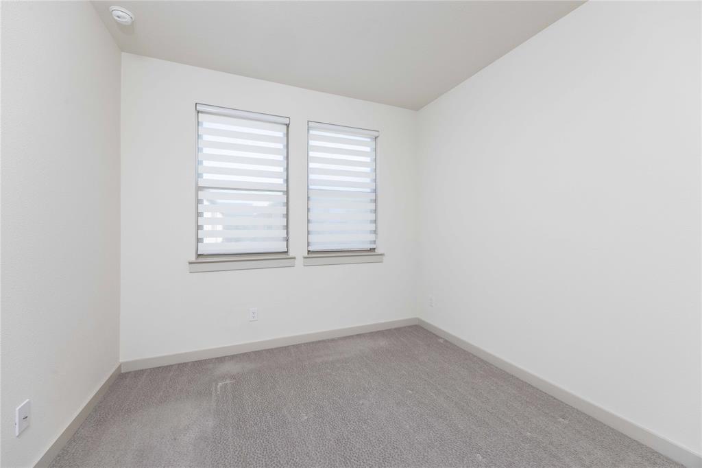 208 Spring Hill Road Flower Mound, TX 75028 - Photo 14 of 35 an empty room with a window