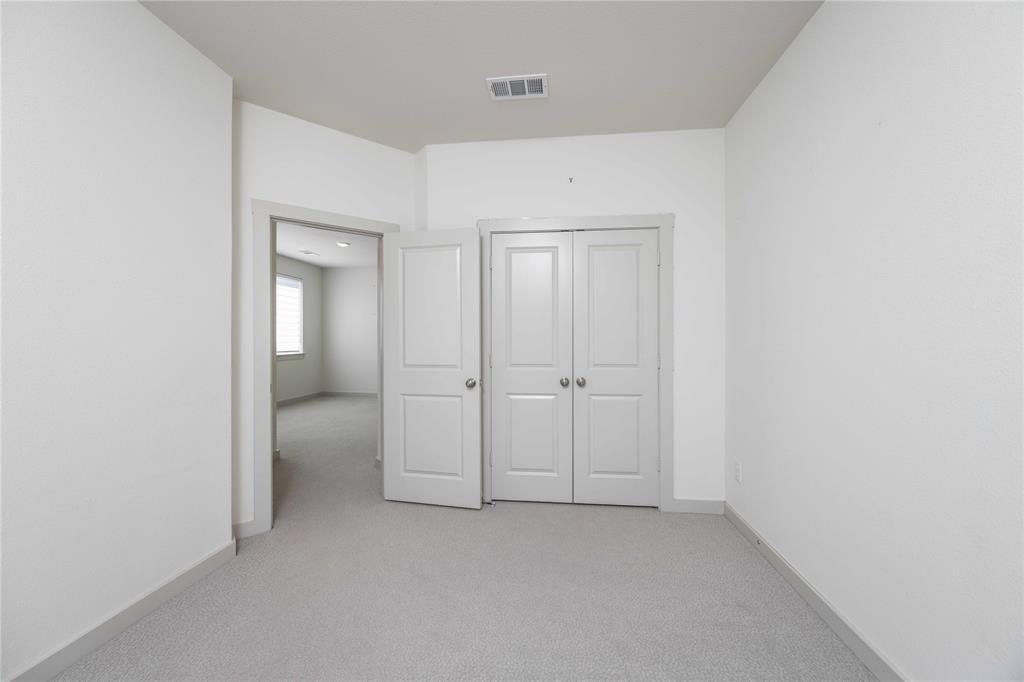 208 Spring Hill Road Flower Mound, TX 75028 - Photo 17 of 35 a view of an empty room