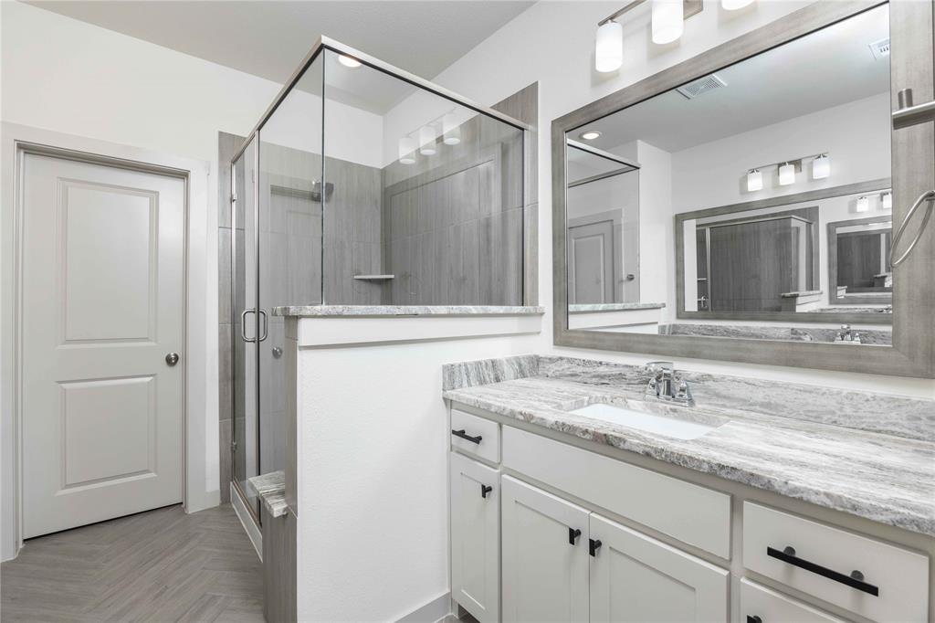 208 Spring Hill Road Flower Mound, TX 75028 - Photo 23 of 35 a bathroom with a granite countertop sink mirror and double