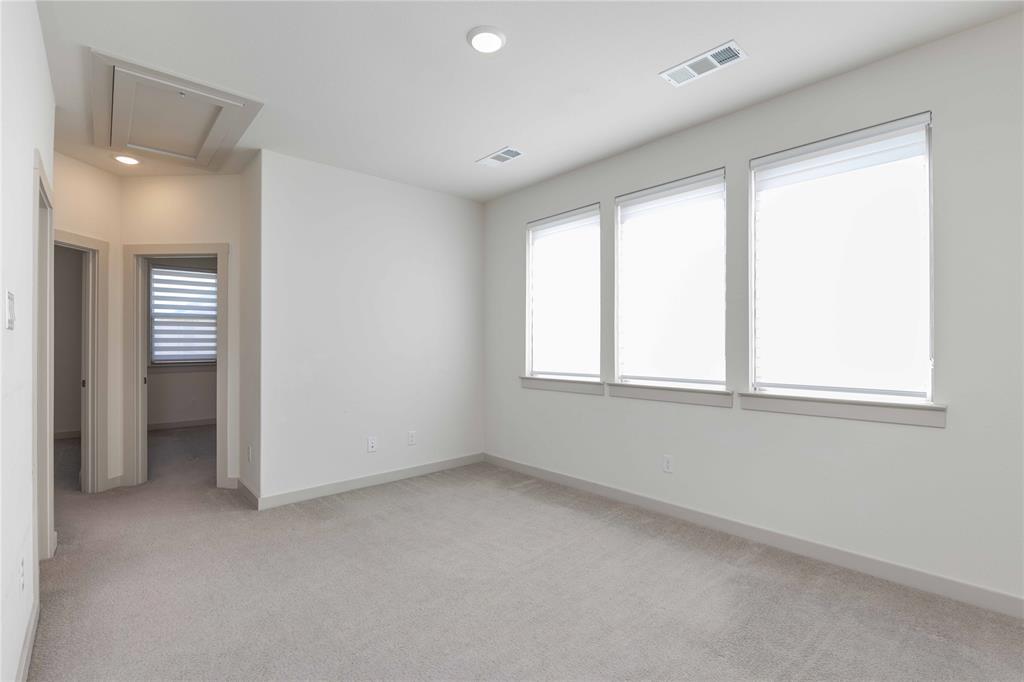 208 Spring Hill Road Flower Mound, TX 75028 - Photo 24 of 35 a view of an empty room with a window
