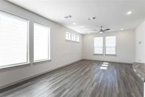 a view of an empty room and a window