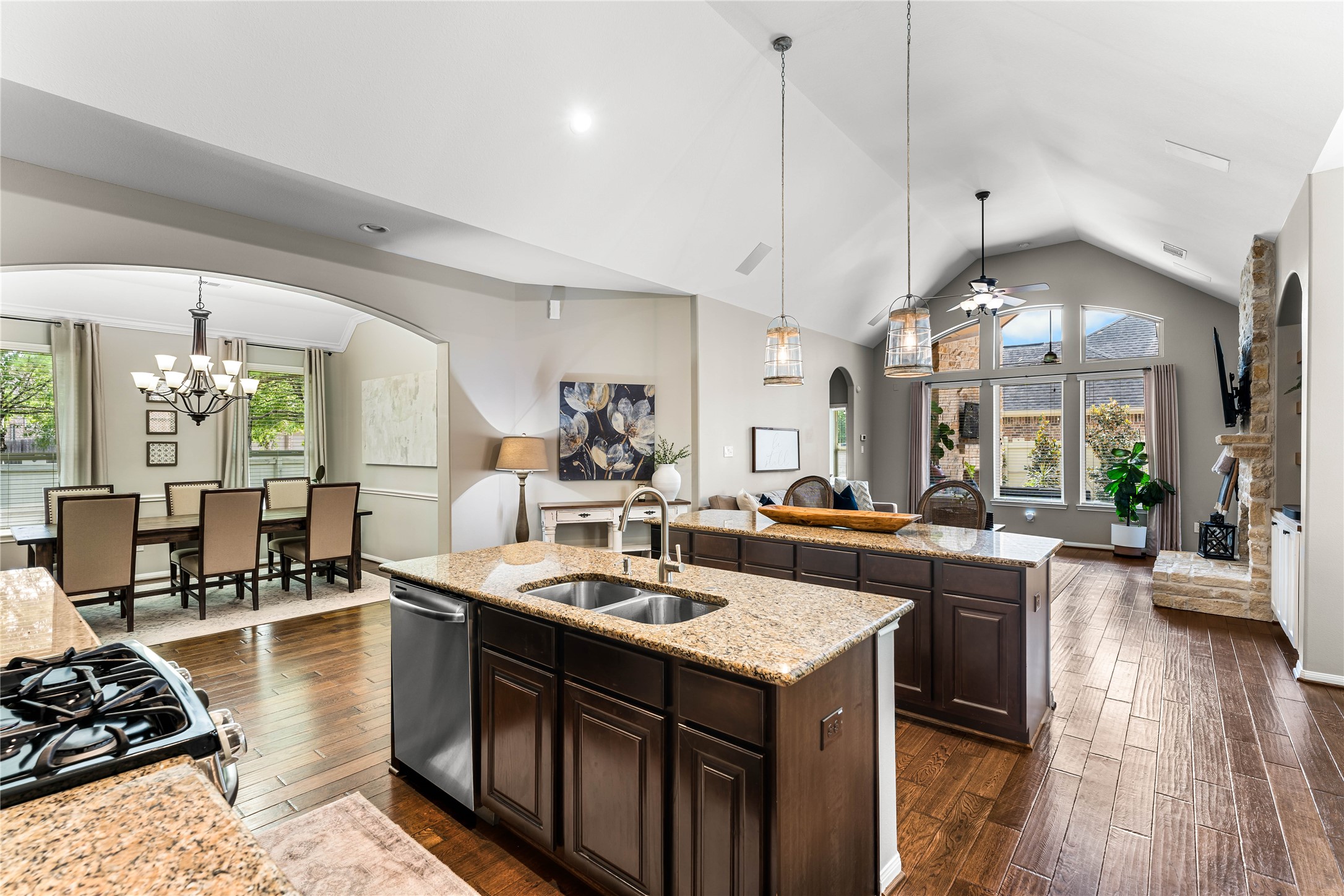 Double-island chef’s kitchen with granite counters and custom cabinetry.
