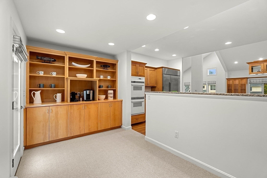 53 Gerald Road Marblehead, MA 01945 - Photo 8 of 42 a living room with stainless steel appliances kitchen island granite countertop a refrigerator and a large window with the garden view