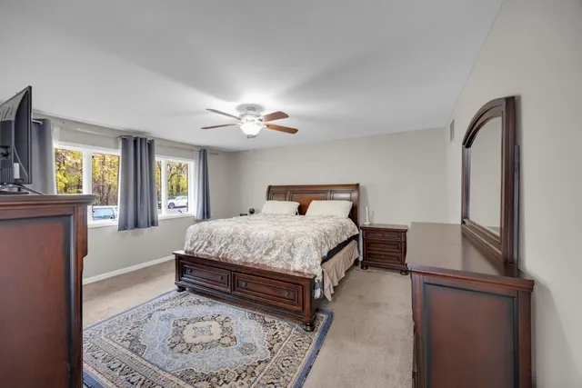 a bedroom with a bed and window