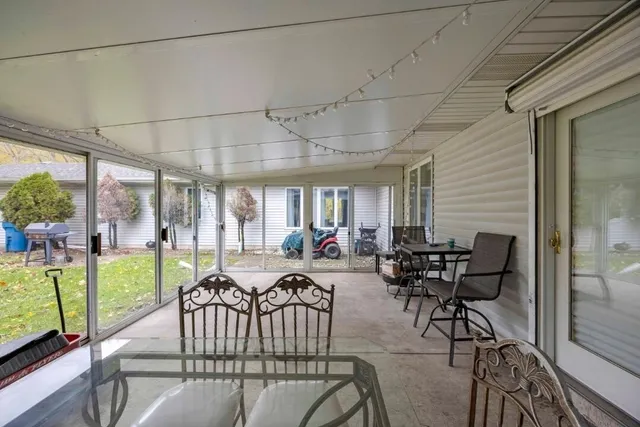 a view of a dining room with furniture window and outside view