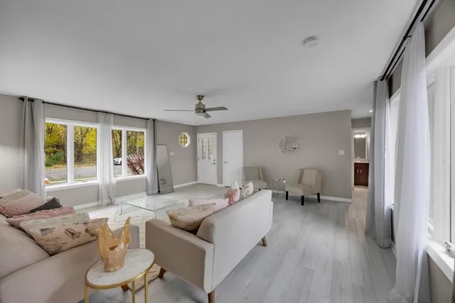 a living room with furniture and a large window