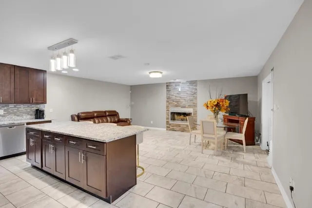 a kitchen with a cabinets and chairs in it