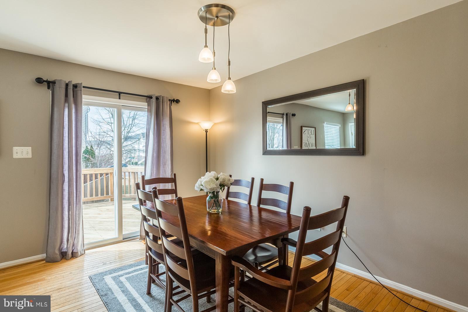 14299 Newbern Loop Gainesville, VA 20155 - Photo 11 of 42 Dining Room-hardwoods, opens to deck
