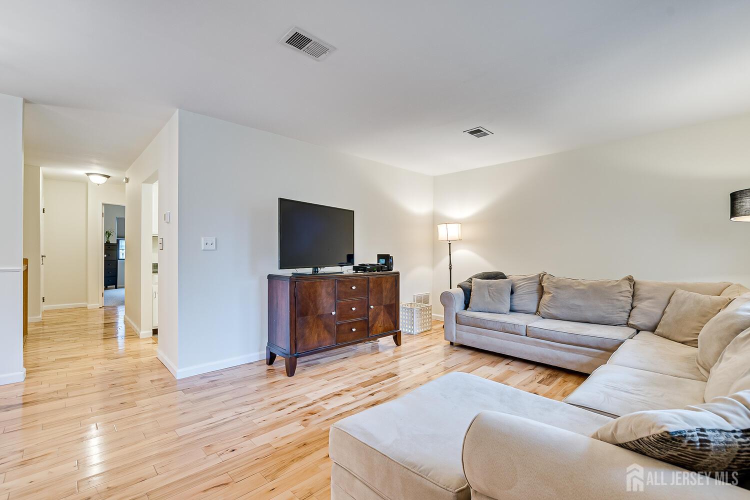 30-5 Prospect Street, Unit 2 Metuchen, NJ 08840 - Photo 10 of 23 a living room with furniture and a flat screen tv