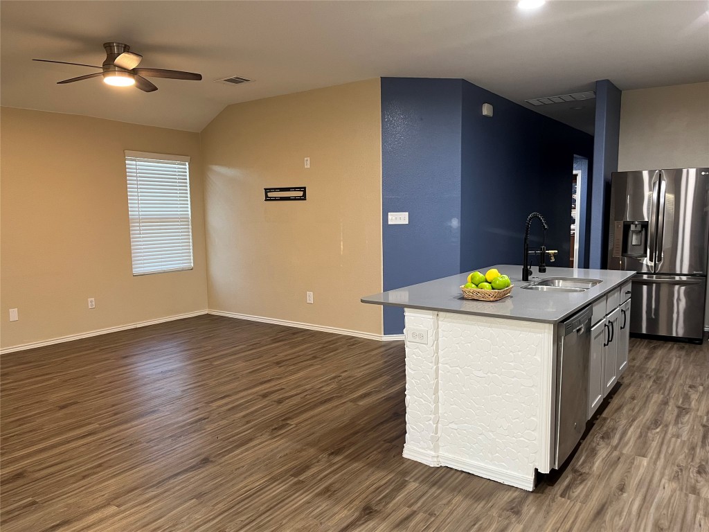 104 Granville Court Jarrell, TX 76537 - Photo 4 of 36 a kitchen that has a sink and a wooden floor