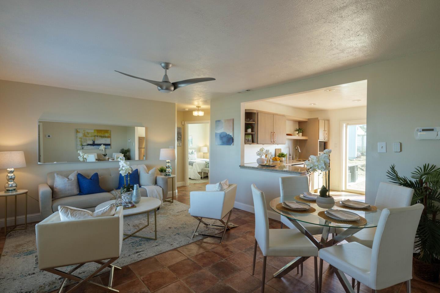555 Esplanade Avenue Pacifica, CA 94044 - Photo 13 of 32 a living room with furniture and a dining table with kitchen view