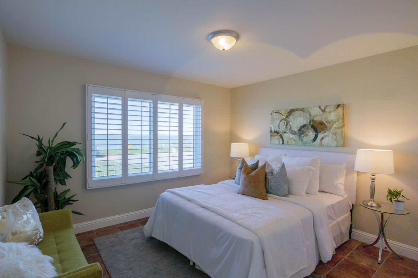 555 Esplanade Avenue Pacifica, CA 94044 - Photo 23 of 32 a bedroom with a bed and a couch