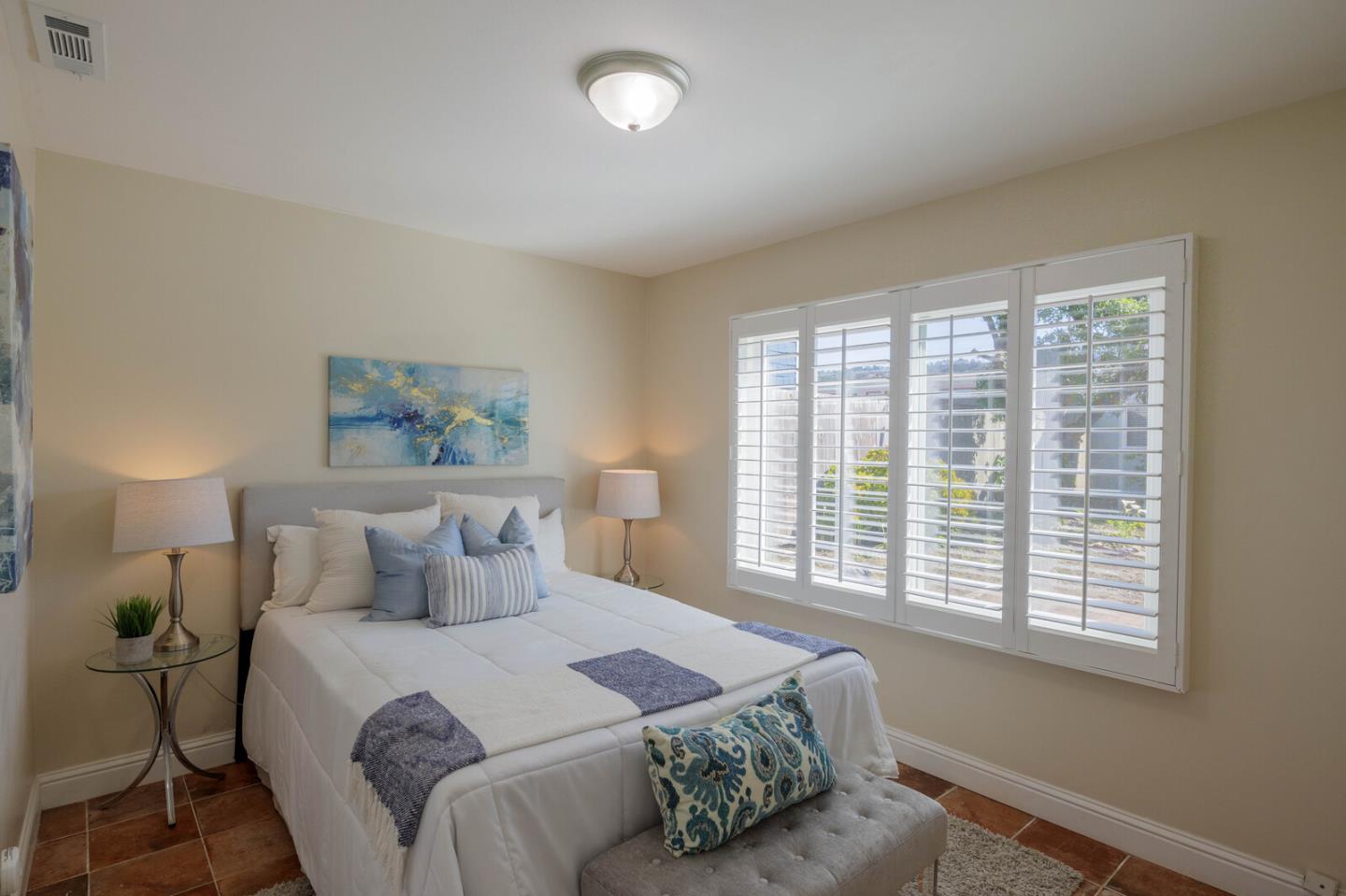 555 Esplanade Avenue Pacifica, CA 94044 - Photo 24 of 32 a bedroom with a bed and a large window