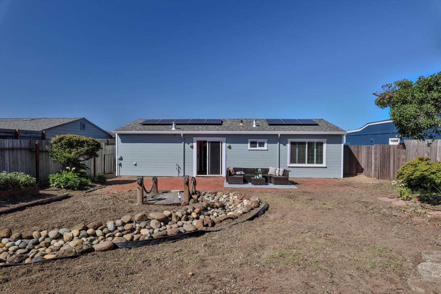 555 Esplanade Avenue Pacifica, CA 94044 - Photo 31 of 32 a front view of a house with a yard
