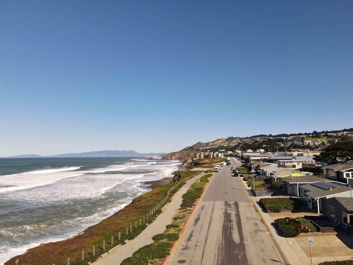 555 Esplanade Avenue Pacifica, CA 94044 - Photo 7 of 32 a view of a city from a terrace