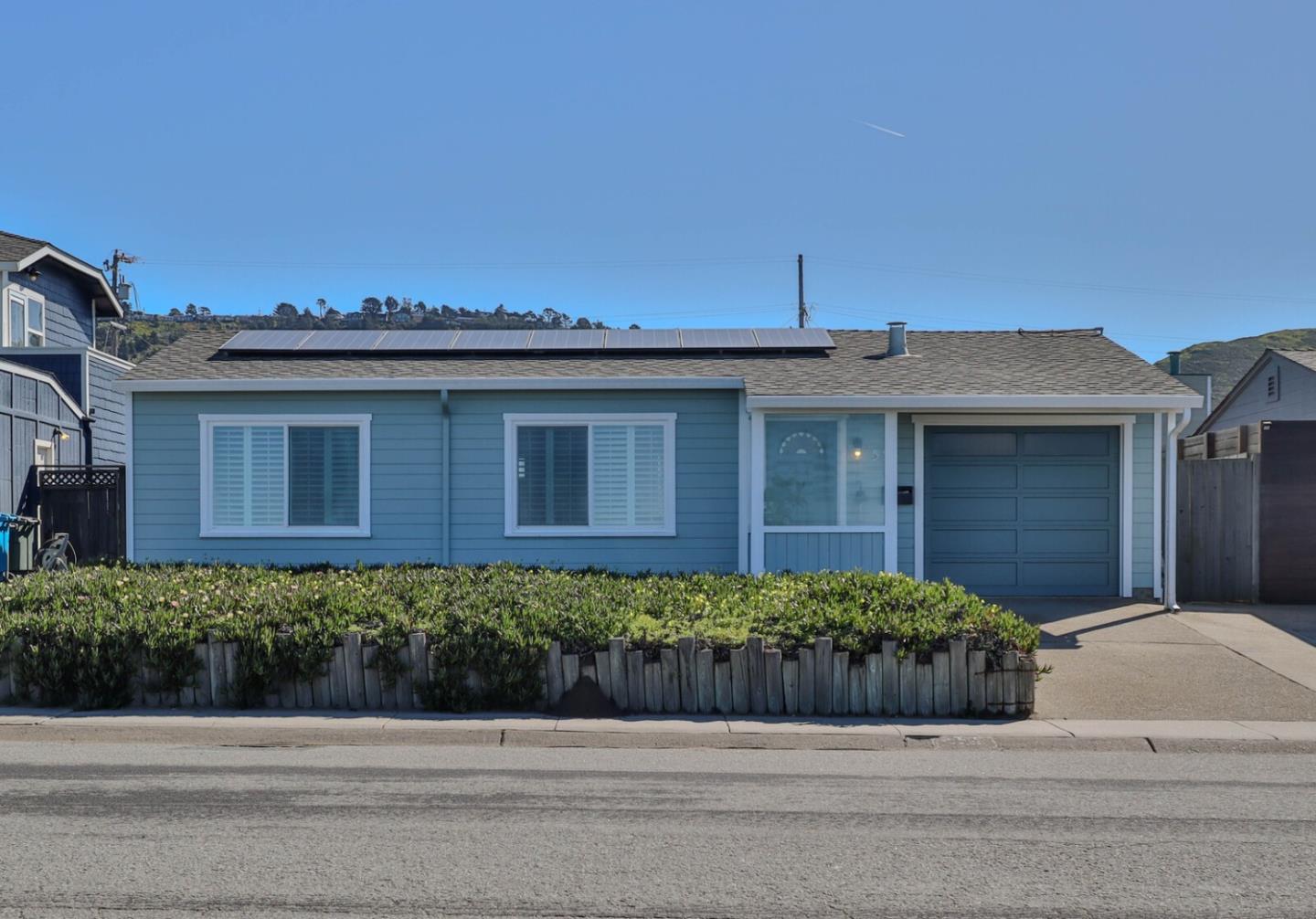 555 Esplanade Avenue Pacifica, CA 94044 - Photo 9 of 32 a front view of a house with a yard