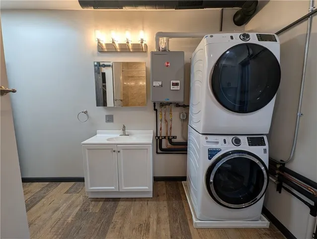 a utility room with sink dryer and washer