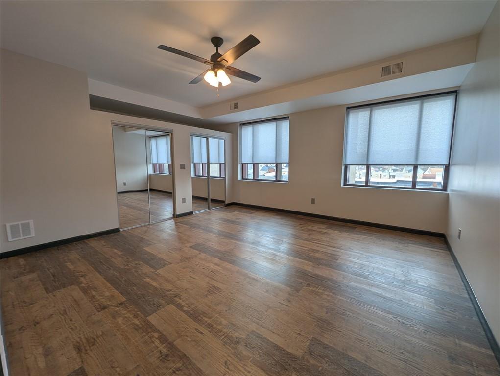 101 East Lincoln Avenue, Unit 3 McDonald, PA 15057 - Photo 4 of 14 an empty room with wooden floor and windows