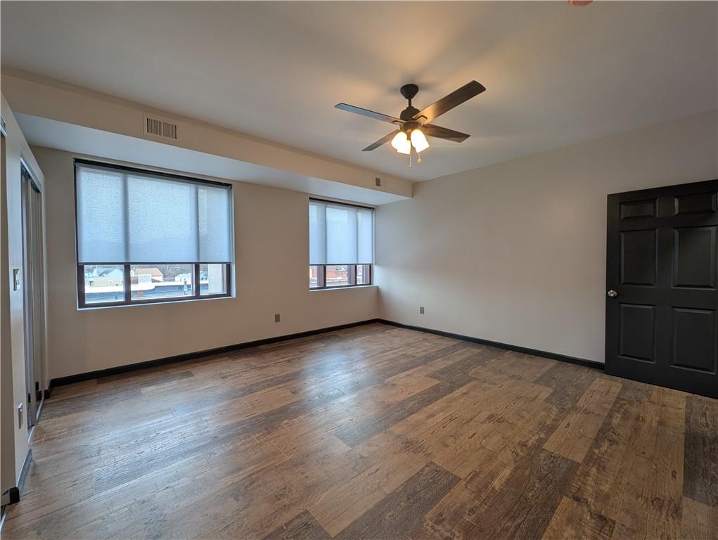 101 East Lincoln Avenue, Unit 3 McDonald, PA 15057 - Photo 5 of 14 a view of empty room with wooden floor and fan
