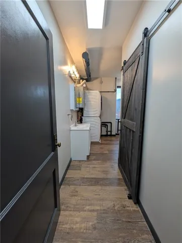 a view of a kitchen from a hallway
