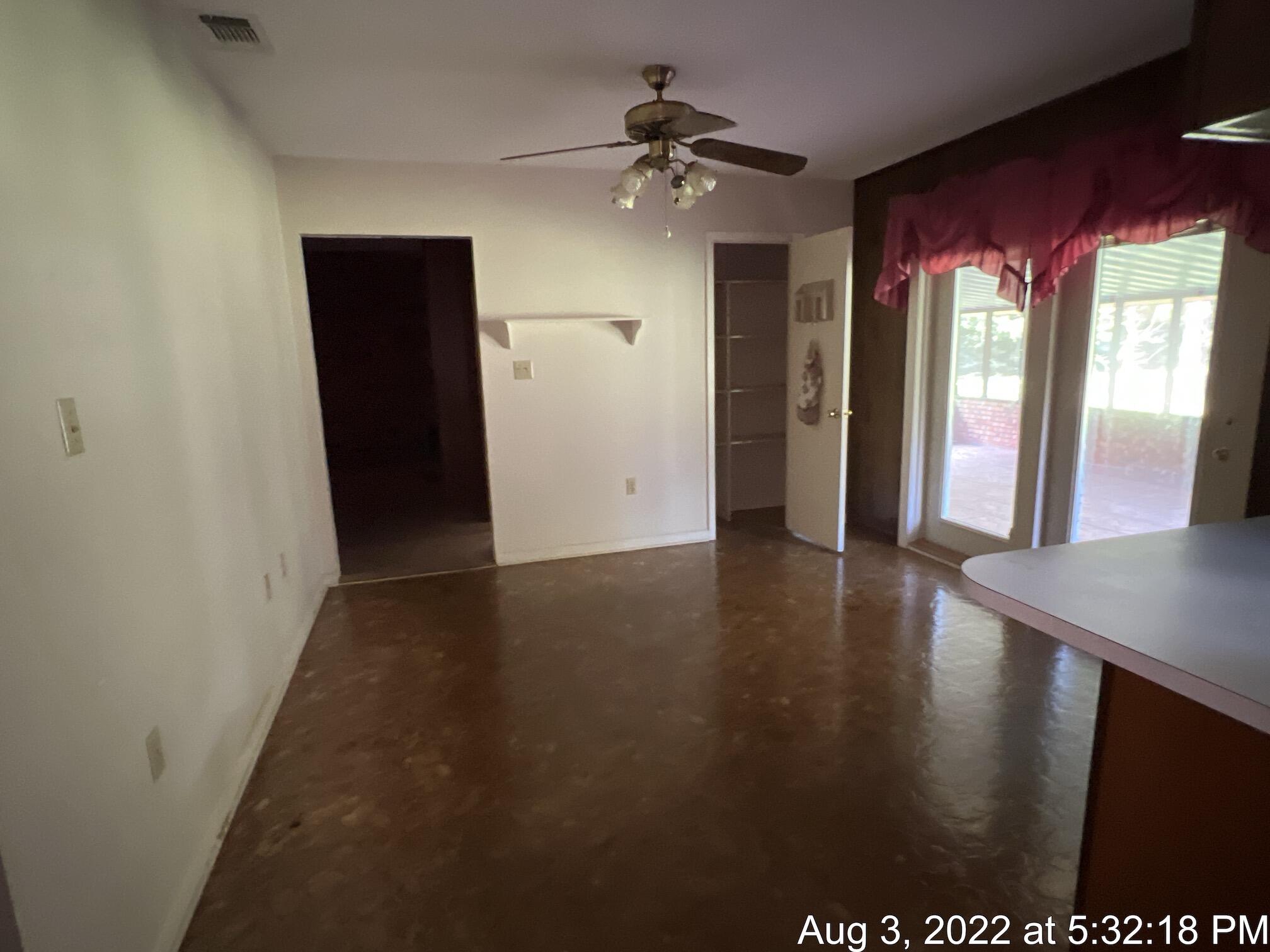 5355 Keyser Mill Road Baker, FL 32531 - Photo 4 of 16 a view of a hallway with wooden floor