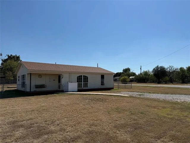 a house with trees in the background