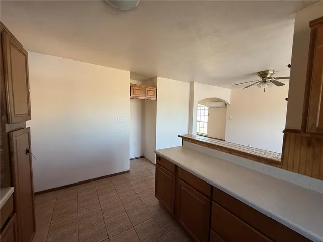 a kitchen with a sink and a refrigerator