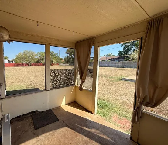 a view of a porch with furniture