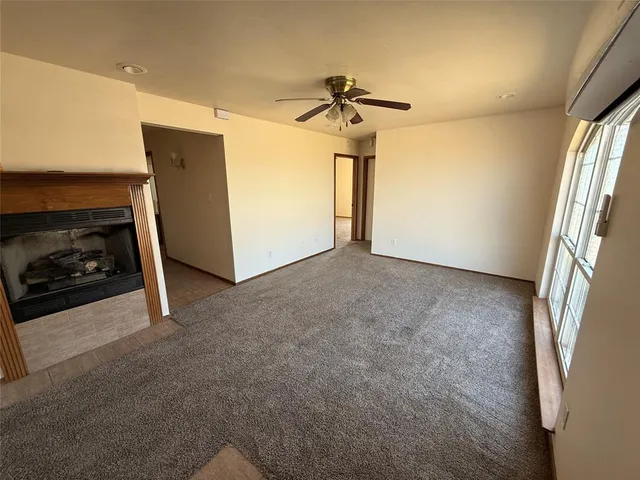 a view of livingroom and hallway with wooden floor