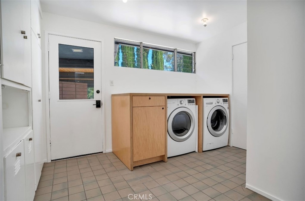 16459 Garvin Drive Encino, CA 91436 - Photo 15 of 26 a utility room with dryer and washer