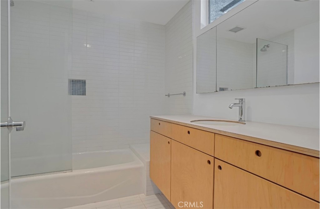 16459 Garvin Drive Encino, CA 91436 - Photo 17 of 26 a bathroom with a sink and a bathtub