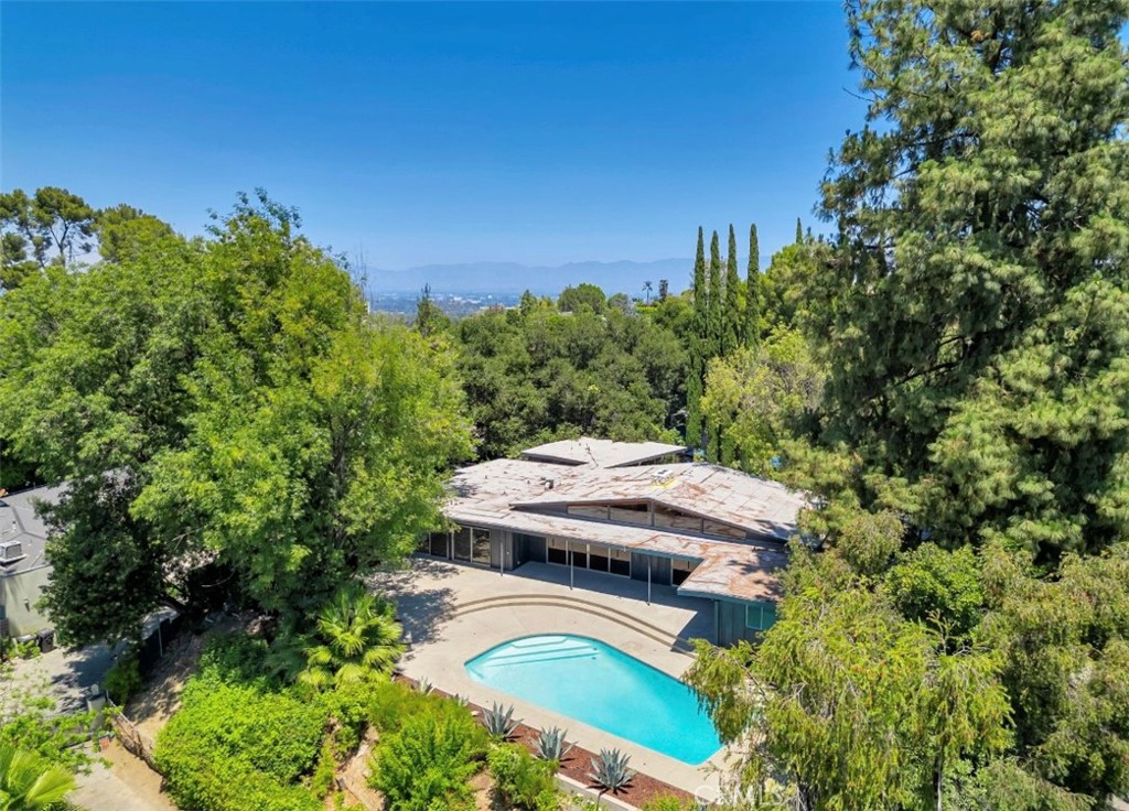 16459 Garvin Drive Encino, CA 91436 - Photo 2 of 26 a aerial view of a house with swimming pool and garden