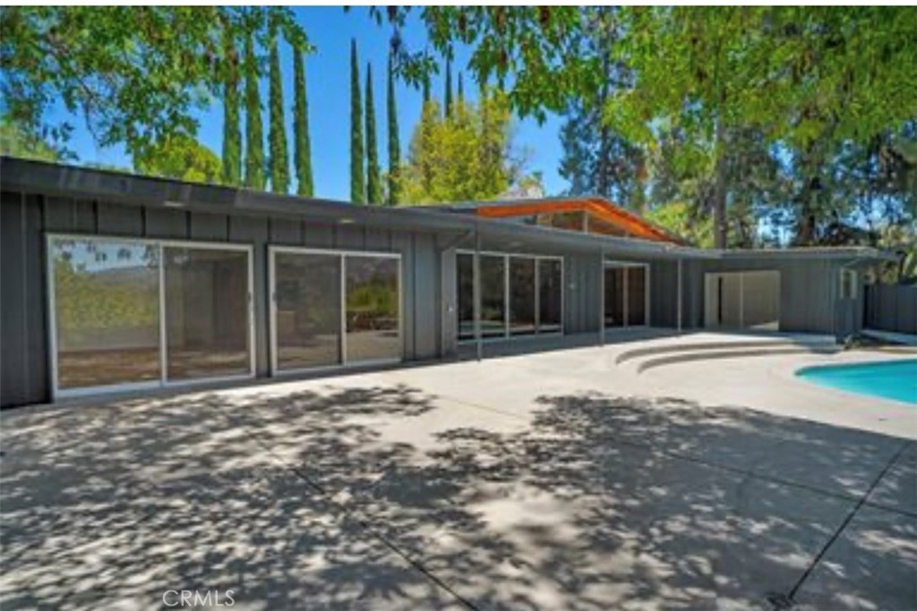 16459 Garvin Drive Encino, CA 91436 - Photo 21 of 26 a house with swimming pool in front of it