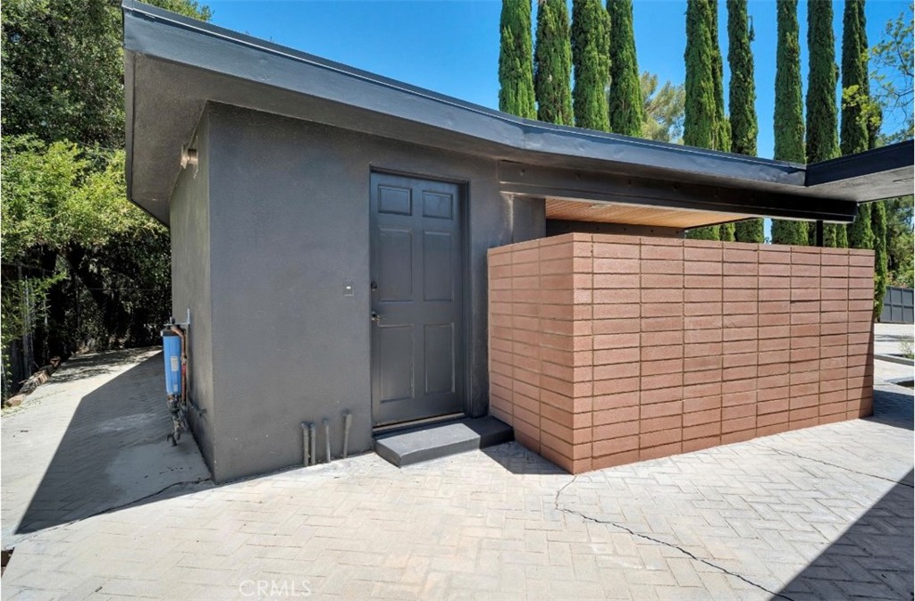 16459 Garvin Drive Encino, CA 91436 - Photo 24 of 26 a backyard of a house with seating space