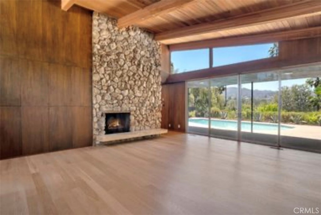 16459 Garvin Drive Encino, CA 91436 - Photo 8 of 26 a view of an empty room with a fireplace