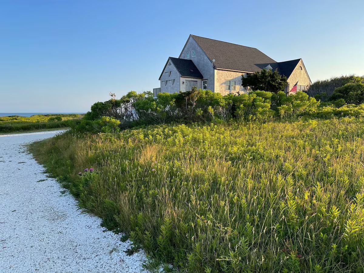 48 Madequecham Valley Road Nantucket, MA 02554 - Photo 17 of 20 a view of a house with a yard and plants