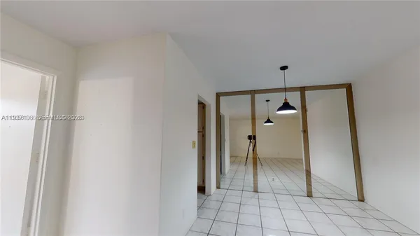 a view of an empty room and window